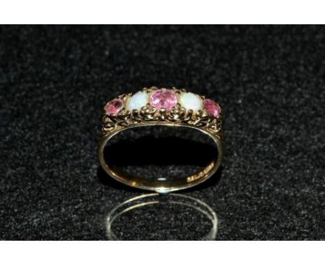 An opal and pale pink ruby quintet ring, alternate set woth three graduating ellipse cut pale pink ruby's and two round opal 