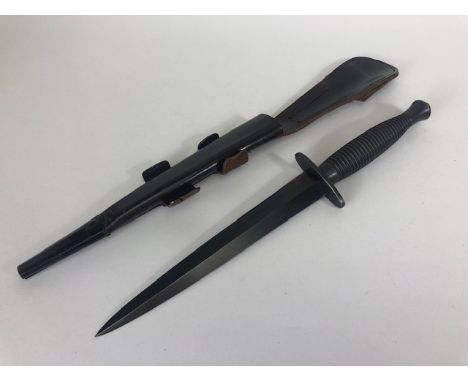 Militaria interest, WW2 period Fairburn Sykes 3rd pattern knife in leather scabbard, top of grip with number 2 