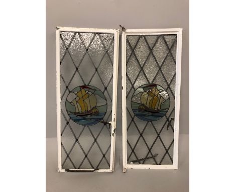 Architectural salvage, pair of metal framed windows with central stain glass panels of ships each approximately 120cm x 49cm 