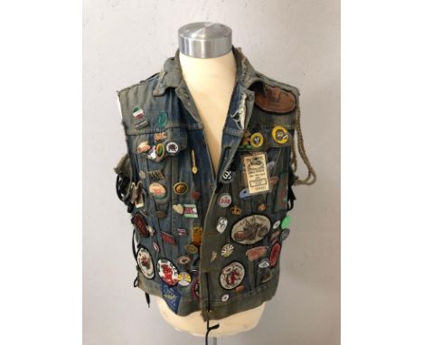 Vintage Clothing, Bikers denim waist coat made from a cut down denim jacket  covered with vintage metal badges and embroidere