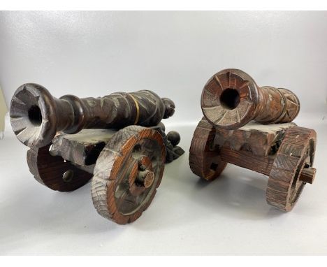 Military interest pair of decorative  20th century carved wooden cannon, each approximately 44 x 28cm