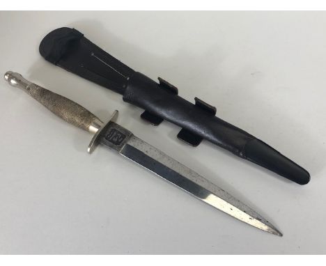 Militaria Interest , Fairburn Sykes knife of 1st pattern design Blade stamped  F-S fighting Knife, in a leather scabbard