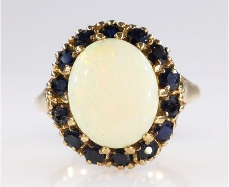 Gold opal and sapphire cluster ring hallmarked 9ct   Condition Report   Click here for further images, condition, auction tim