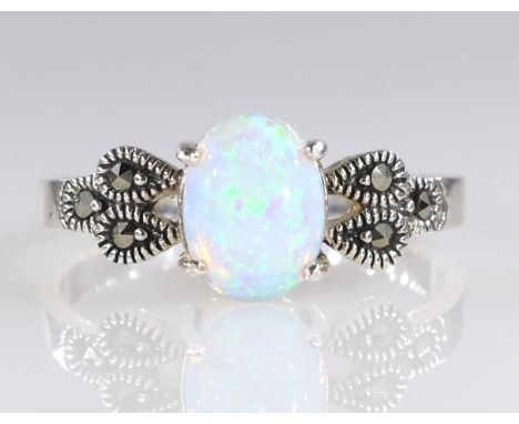 Silver opal and marcasite ring stamped 925   Condition Report   Click here for further images, condition, auction times & del