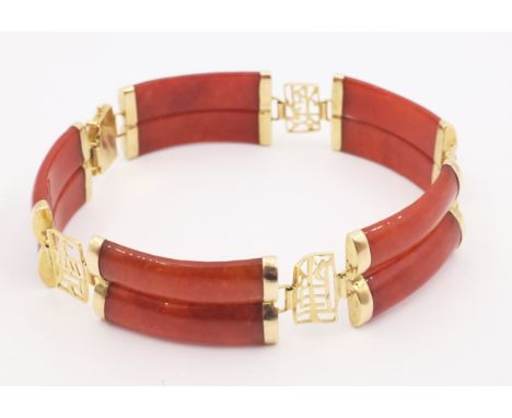 Gold mounted red jade bracelet stamped 14K585 Condition Report Click here for further images, condition, auction times &amp; 