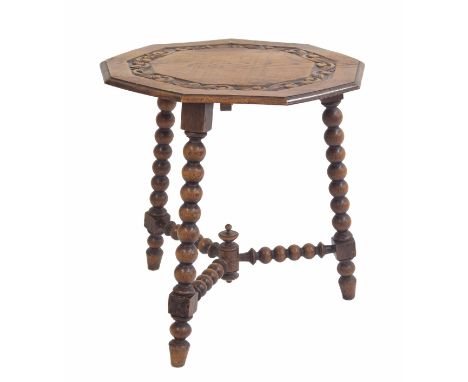 Oak nonagon side table, the moulded top with relief carved foliate scrolling border raised upon three bobbin turned legs unit