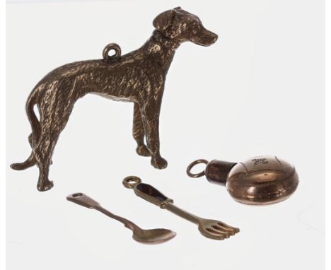 Miniatures to include a 9ct gold greyhound dog charm,19.2g, 32mm high; miniature flask charm 25mm, miniature 9ct spoon and ye