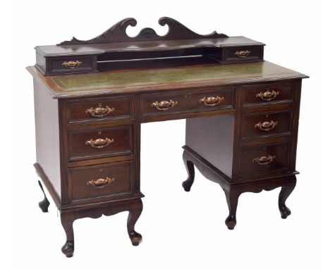 Early 20th century mahogany desk, the raised back over inset tooled leather writing service, on twin pedestal base of three s