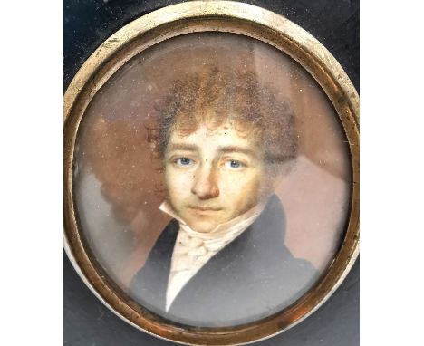 A 19th century miniature oval portrait of a gentleman in smart dress. Framed and glazed. Oval H.7.3 x W.5.7cm, H.13.5 x W.11.
