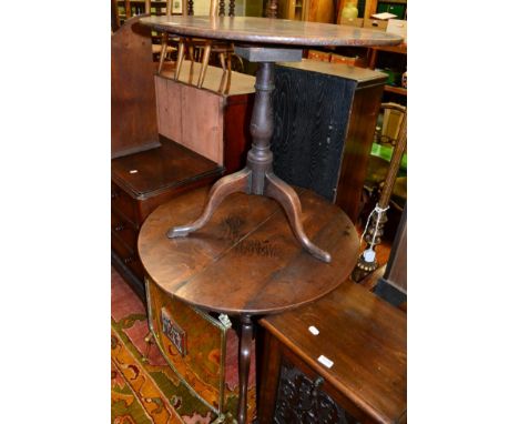 Two similar oak tripod tables 