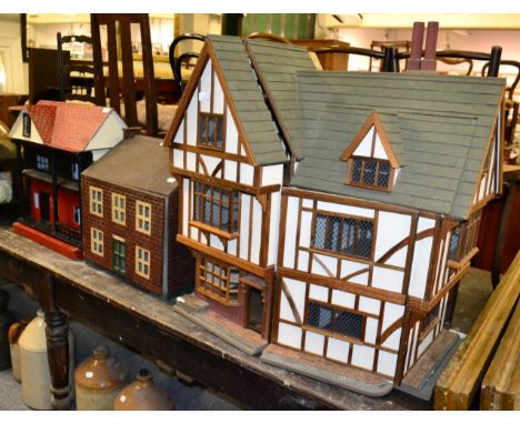 Two pre-war vintage dolls houses and another, half timbered example, dated (19)94 to underside (3)