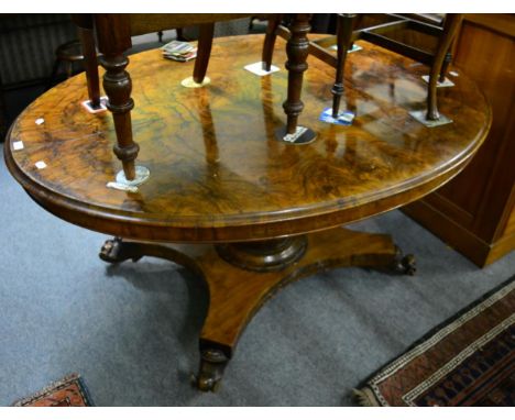 A Victorian walnut oval loo table on central pillar support