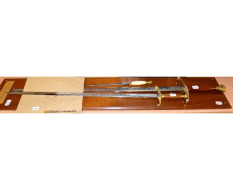 Three Wilkinson Sword Ltd. York commemorative swords with letters and cards of authenticity, one with mahogany display board