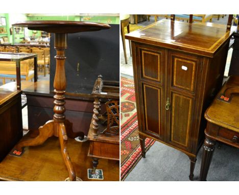 An Edwardian mahogany and satinwood banded two door music cupboard; and a Victorian mahogany spindle turned tripod table (2)