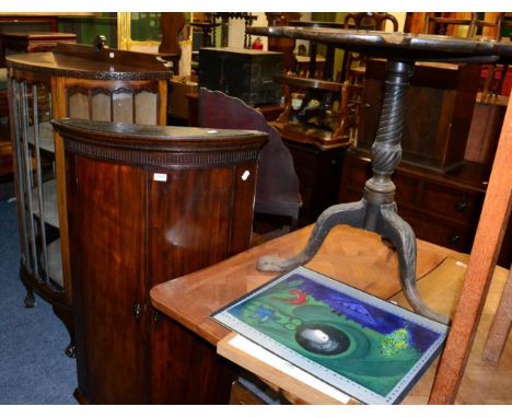 An early 20th century mahogany Chippendale style demi-lune display cabinet with blind fret carving and ball and claw feet; to