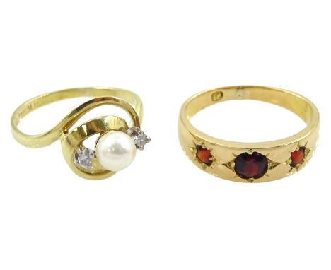 Early 20th century 18ct gold gypsy set three stone garnet ring and a 14ct gold pearl and diamond ring with openwork settingCo