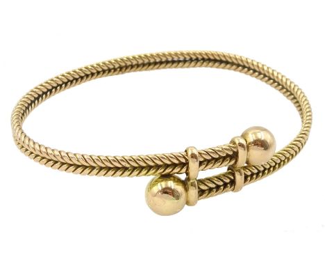 Early 20th century 15ct gold twist bangle with bead terminalsCondition Report:Approx 25.6gm, tested 15ct, slight split to the