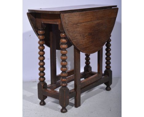 Old oak gateleg table, oval top, bobbin turned supports with plain gates, 75 x 96cms.