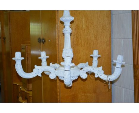 A white painted five light chandelier, French, carved and scrolled decoration, 76cm drop.