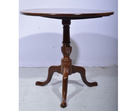 Mahogany pedestal table, circular tilt top, baluster column on tripod legs, diameter 75cms.