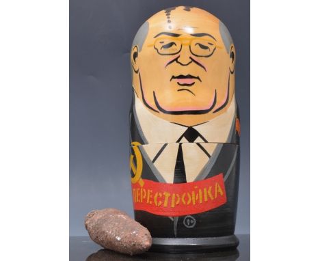 Set of Russian dolls, President Gorbachev, 20cms, a carved bamboo paper knives, an antique flask, Roman style, two cigarette 