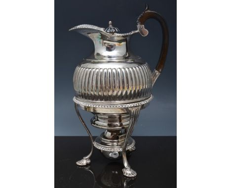 Edwardian silver spirit jug, London 1901-07, semi-fluted near spherical form, the stand on tripod legs, webbed feet, 23cms.