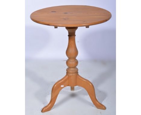 Pine pedestal table, circular tilt top, baluster column, tripod legs, diameter 60cms.