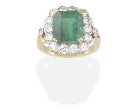 EMERALD AND DIAMOND CLUSTER RING The step-cut emerald within a brilliant-cut diamond surround, emerald approx. 7.95cts, diamo