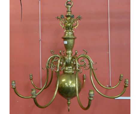 A large Dutch brass eight branch chandelier