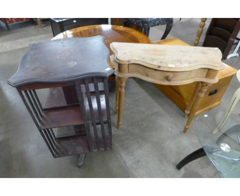 A Victorian inlaid mahogany revolving bookcase and a pine console table
