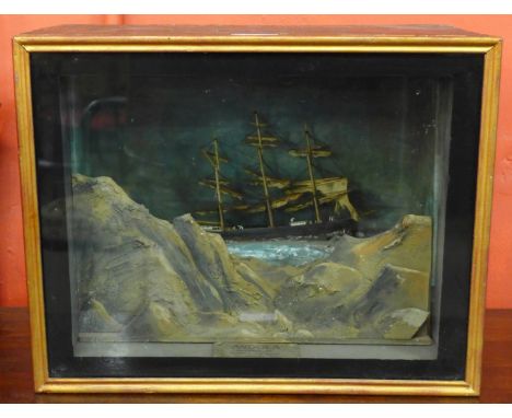 A musical automaton diorama, Andola, Wrecked On Sharks Fin Rock, 31st January, 1895, cased, 30cms h, 39cms w, 22cms dThe thre
