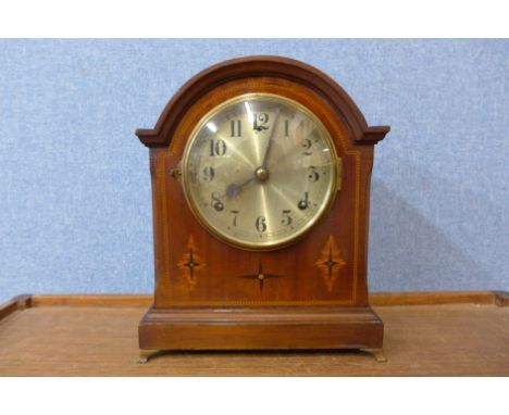 An Edward VII inlaid mahogany mantel clock