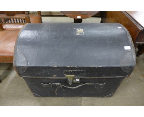 A fitted dome top steamer trunk