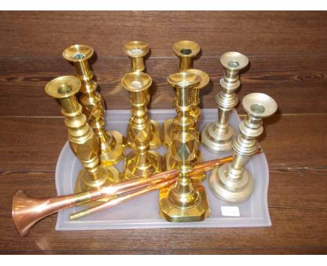 THREE PAIRS OF BRASS CANDLESTICKS also including a pair of white metal candlesticks and a single brass candlestick; together 