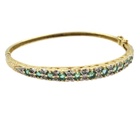 9ct gold graduating round emerald and diamond hinged bangle, stamped 375Condition Report:Approx 11.8gm, inner circumference =