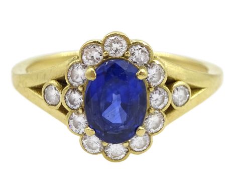 18ct gold oval cut sapphire and round brilliant cut diamond cluster ring, with diamond set split shoulders, hallmarked, sapph