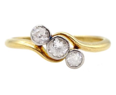 Early-mid 20th century gold old cut three stone diamond crossover ring, stamped 18ct, total diamond weight approx 0.30 caratC