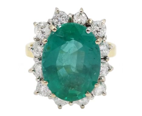 18ct gold oval emerald and round brilliant cut diamond cluster ring, hallmarked, emerald approx 5.90 carat, total diamond wei