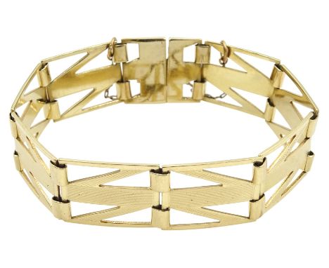 Gold engine turned geometric link bracelet, stamped 9ctCondition Report:Approx 24.8gm, length = 19.2cm, depth = 1.7cm, light 