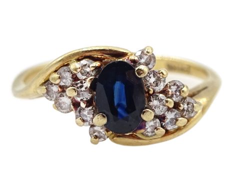 Gold oval sapphire and diamond crossover cluster ring, stamped 14KCondition Report:Approx 3.5gm, size P, max head diameter = 