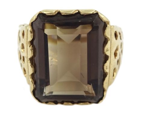 9ct gold single stone emerald cut smoky quartz ring, with pierced design shoulders, hallmarked Condition Report:Approx 7.7gm,