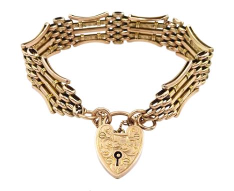 Early 20th century rose gold gate bracelet with engraved heart locket clasp, maker's mark W.J.S, stamped 9ct Condition Report