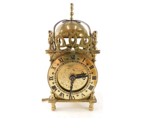 A 20thC brass lantern clock, of small proportion, with 7cm diameter Roman numeric dial, and electrical feature, 19cm high. 