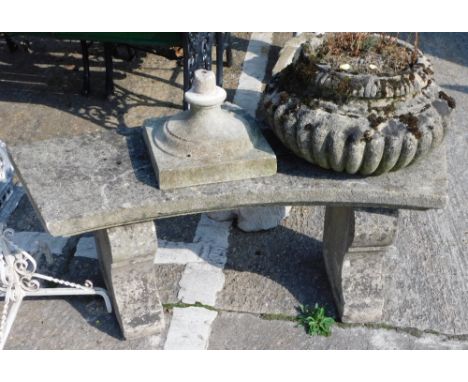 A concrete bench, of curved form, on shaped legs, 42cm high, 88cn wide, 37cm deep, and a classical design planter. 