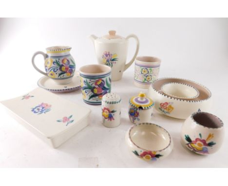 Various Poole pottery, to include a jug decorated with flowers predominantly in purple, yellow and green, 12cm high, various 