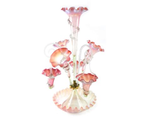 A Victorian pink and white opaque epergne, with three trumpet shaped vases and scrolls  suspended with tapering baskets, 59cm