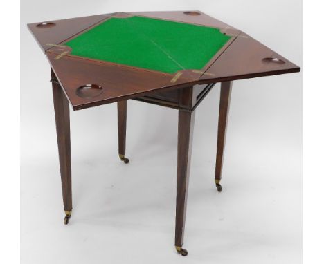 An Edwardian mahogany envelope card table, with gilt brass inlay, the four sectional top raised above square tapering legs, o