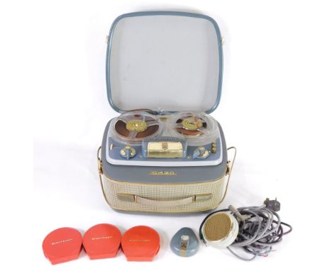 A Grundig TK20 cased reel to reel tape recorder, with a quantity of accessories.&nbsp;