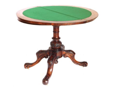 A Victorian figured walnut and a marquetry demi lune shaped card table, the top with a moulded edge, enclosing a baize lined 