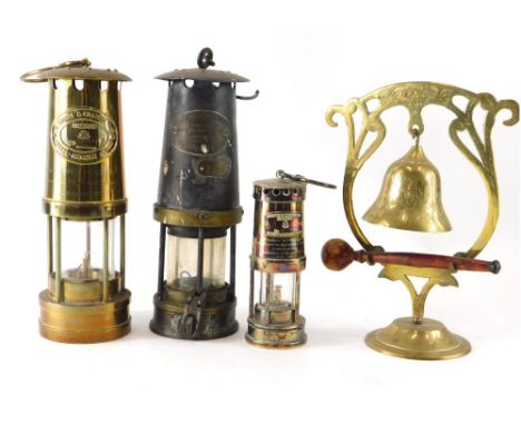 A 20thC Thomas and Williams miner's lamp, of cylindrical form with glass centre, 26cm high, another miniature example marked 